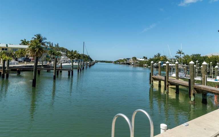 35` of seawall dockage on extra wide canal with water. power, and fish cleaning station.